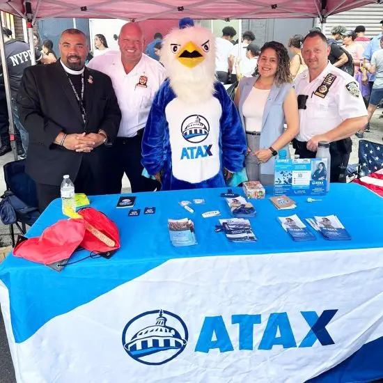 ATAX franchise team at a local community event with the ATAX mascot — neighborhood outreach