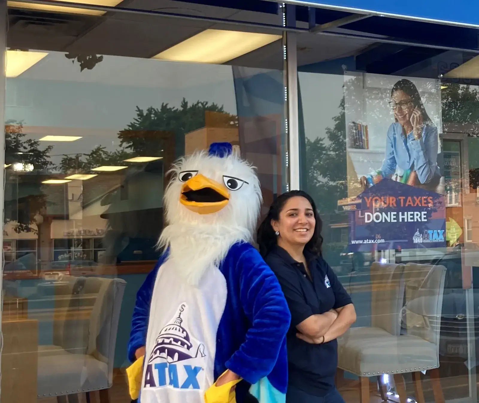 ATAX franchise team in front of a Latino-owned tax preparation storefront — Bronx, NY